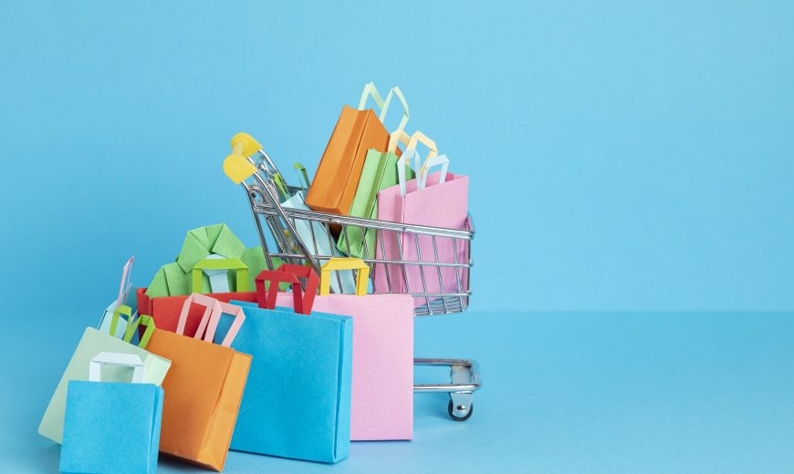 Shopping basket full of paper bags. Sesonal sale, online deals, discounts, promotions idea